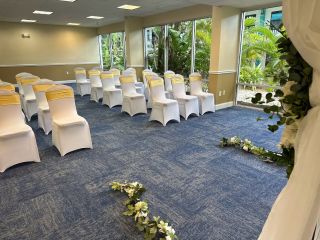 A Room With White Chairs And Tables