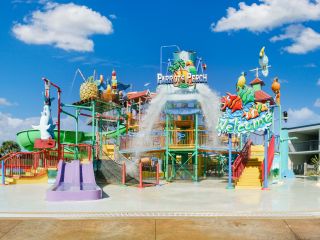 A Colorful Playground With A Blue Sky